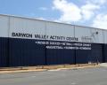 Exterior view of the Barwon Valley Activity Centre, featuring signage for sports and community activities against a clear blue sky.