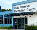 Exterior view of the Civic Reserve Recreation Centre featuring large windows and a welcoming entrance, surrounded by greenery.