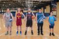 5 people from the all abilities teams standing and holding basketballs