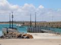 Harbour View with jetties, boat and rock wall